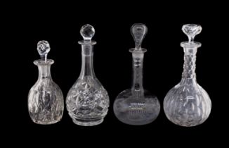 Four 20th century cut glass decanters with stoppers, one signed "SM", others unmarked.