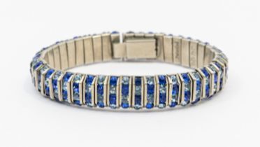 A vintage paste set blue stone white metal bracelet by Schreiber & Hiller, comprising channel set