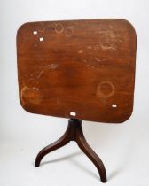 A 19th century mahogany rectangular tilt top table on tripod legs.