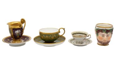 A 19th century green ground and gilded detail tea cup and saucer along with a continental heavily