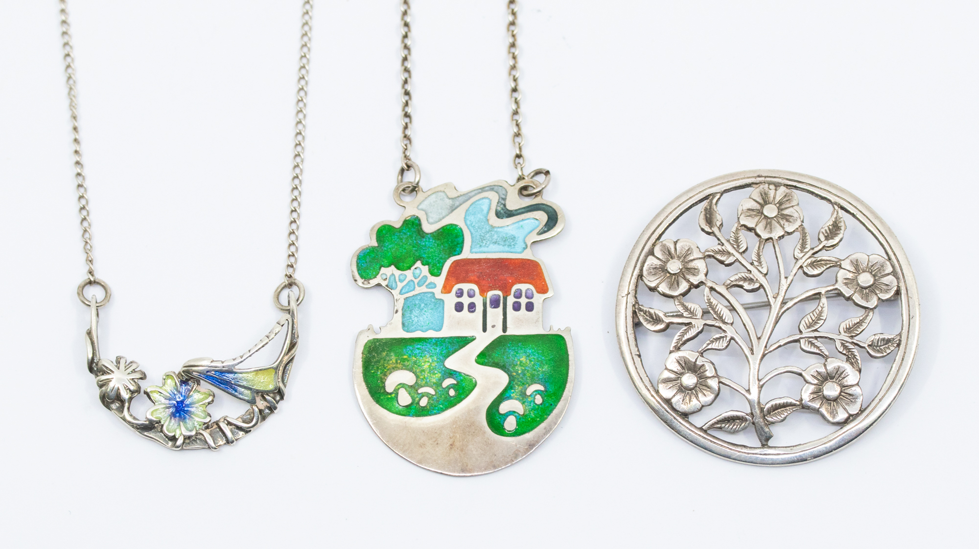 Scottish Interest: a Norman Grant silver and enamel pendant and chain, the pendant depicting a house