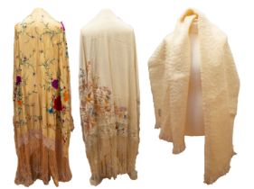 An early 1920s cream silk shawl with long silk tassels attached  to a silk crochet border,