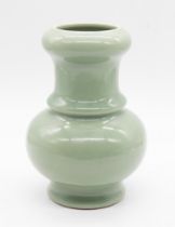 A Chinese celadon glazed porcelain baluster vase, 20th century, with seal mark of the Qianlong