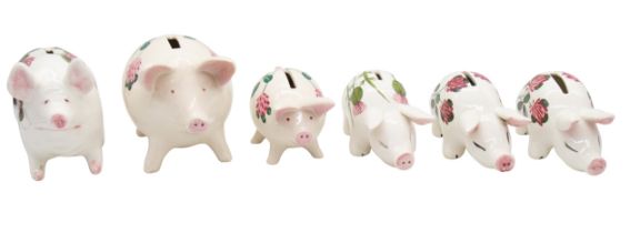 A collection of Plichta pig money banks, six in all with hand painted patterns, mid 20th Century (