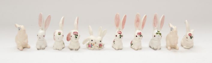 A small collection of mid 20th Century Pilchta seated bunny rabbits, mostly decorated with flowers &