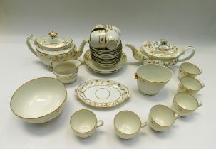 Derby porcelain cream and gilt tea service, c.1800-1810, with teapot, cream jug, sugar pot, slop