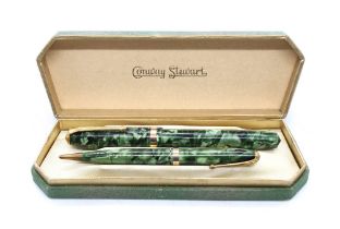 A cased Conway Stewart fountain pen and pencil, pen having a 14ct gold nib.