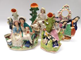 Collection of five late 19th century Staffordshire flat backs, spill holders, pocket watch holder