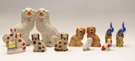 Collection of 19th century mixed Staffordshire dogs, pairs and singles, all spaniels, along with two