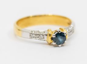 A sapphire and diamond 18ct  gold ring, comprising a round mixed cut sapphire approx 4mm, claw set