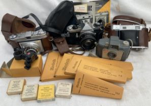 A collection of vintage cameras to include Kodak Retinette, Kodak Retina, Pentax, Colt, along with