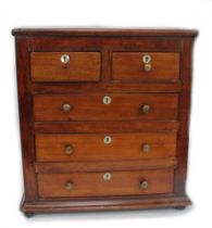 A 19th Century mahogany apprentice chest of two over three drawers, on ball feet, mother of pearl