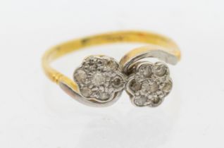 A diamond and 18ct gold flower cluster ring, comprising a double flower cluster platinum set with