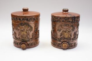 Two 19th century brown salt glazed spirit barrels, applied relief of Royal Crest design, Lions and