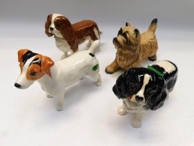 Four boxed Beswick dogs, terrier, spaniels, Jack Russell.