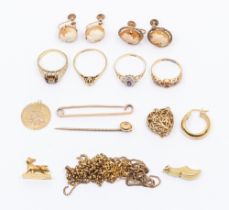 A collection of weighable 9ct gold jewellery including chains, brooch, stone set rings, diamond