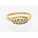 A diamond and 18ct gold boat head ring, comprising five graduated diamonds set in platinum, width