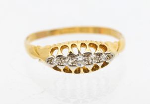 A diamond and 18ct gold boat head ring, comprising five graduated diamonds set in platinum, width
