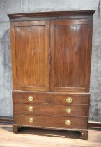 George III mahogany linen cupboard, two opening cupboard doors to reveal three linen drawers above