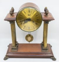 A large mid 20th Century mahogany 8 day Continental mantel clock, by Urgos, with Roman numerals and