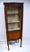 Edwardian serpentine front glazed display cabinet.