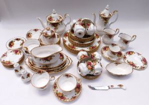 A large collection of Royal Albert old country rose dinner, tea and coffee wares.