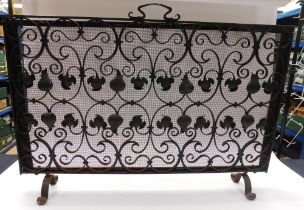 An early 20th century cast iron fire screen, having stylised foliage Nouveau style design.