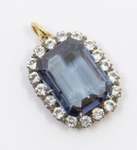 A synthetic colour change sapphire and spinel 9ct gold pendant, comprising a rectangular step cut