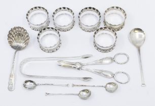A collection of silver to include; a pair of George III silver engraved sugar tongs, hallmarked by