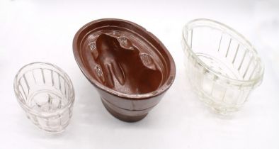 2 vintage glass and one salt-glazed jelly mould (chip to salt-glazed). (3)