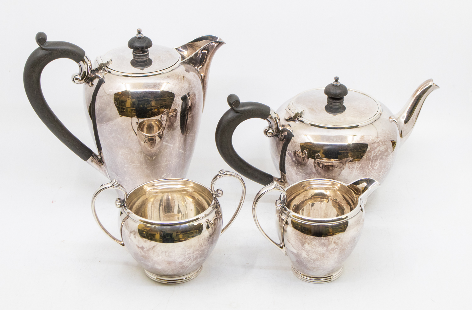 A mid 20th century hand soldered plated four piece coffee and tea set, stamped (4)