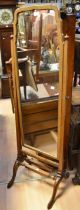 A 19th century mahogany swing dressing mirror on padded legs, original pier glass finial, detail