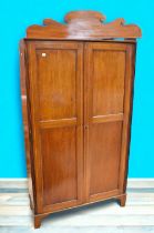A late Georgian slender hat collar and scarf hall cupboard in mahogany with two opening front