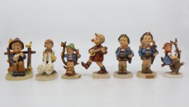 A collection of seven Goebel/Hummel figurines including; Home from Market, Happiness and others.