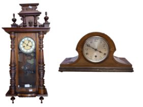 Late 19th century mahogany 8 day german wall clock along with a 1920s Napoleon hat mantle clock.