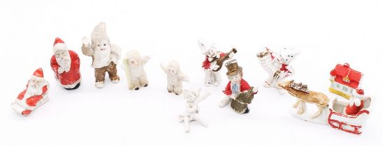 A collection of late Victorian bisque cake decorations, to include snowbabies, Father Christmas,