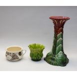 A late 19th century Bretby jardinière stand and pot, along with other porcelain pots and figures,(