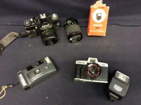 Late 20th Zenith automatic camera with accessories and lenses along with Canon camera and flashes.