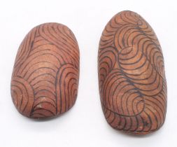 A pair of Aboriginal Coolamon, being burntwood with poker work designs.