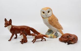 Collection of Beswick foxes and barn owl.