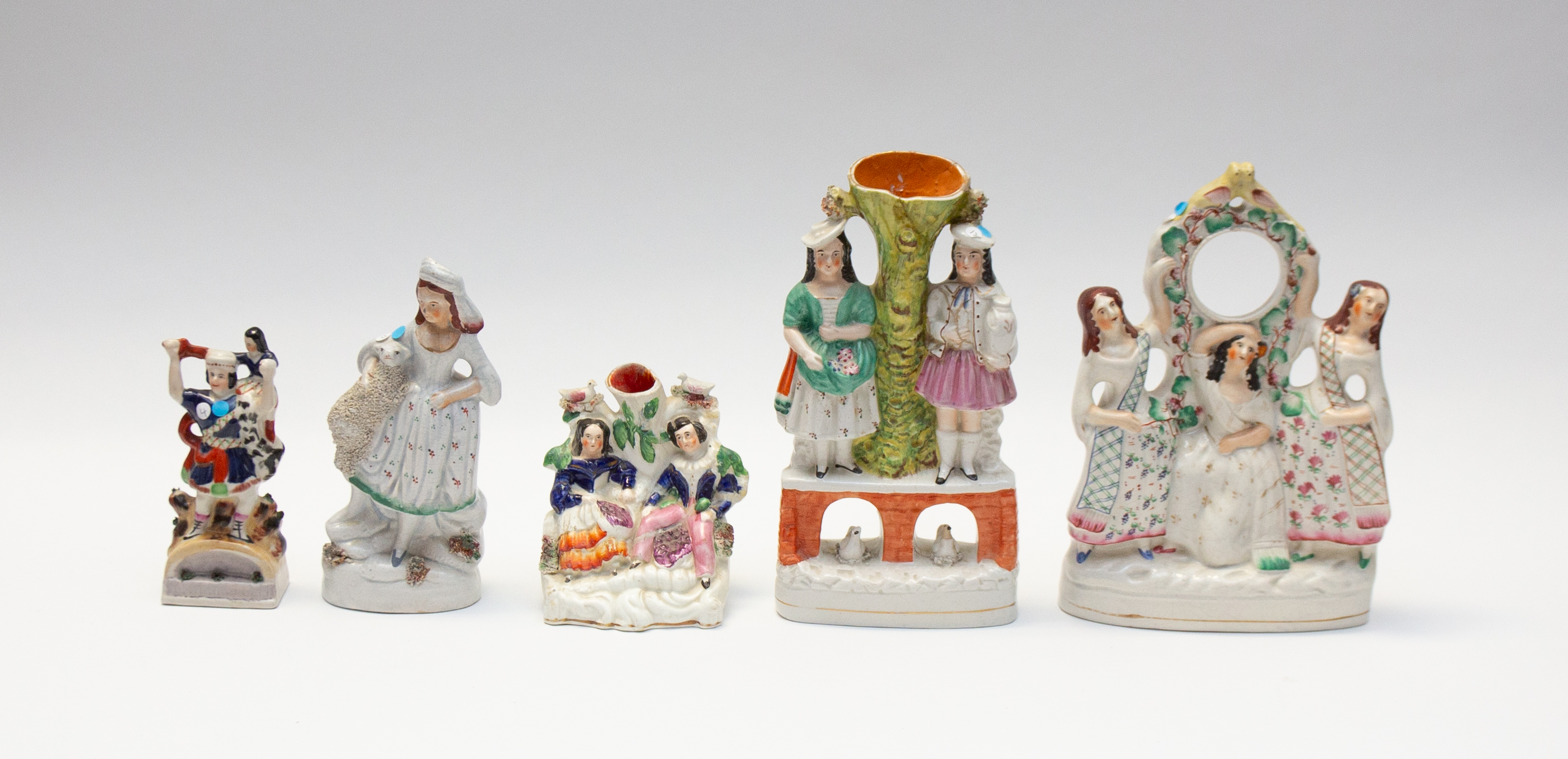 Collection of mid to late 19th century Staffordshire flat back figures, spill and watch holder