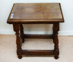 An early 20th century oak style joint stool.