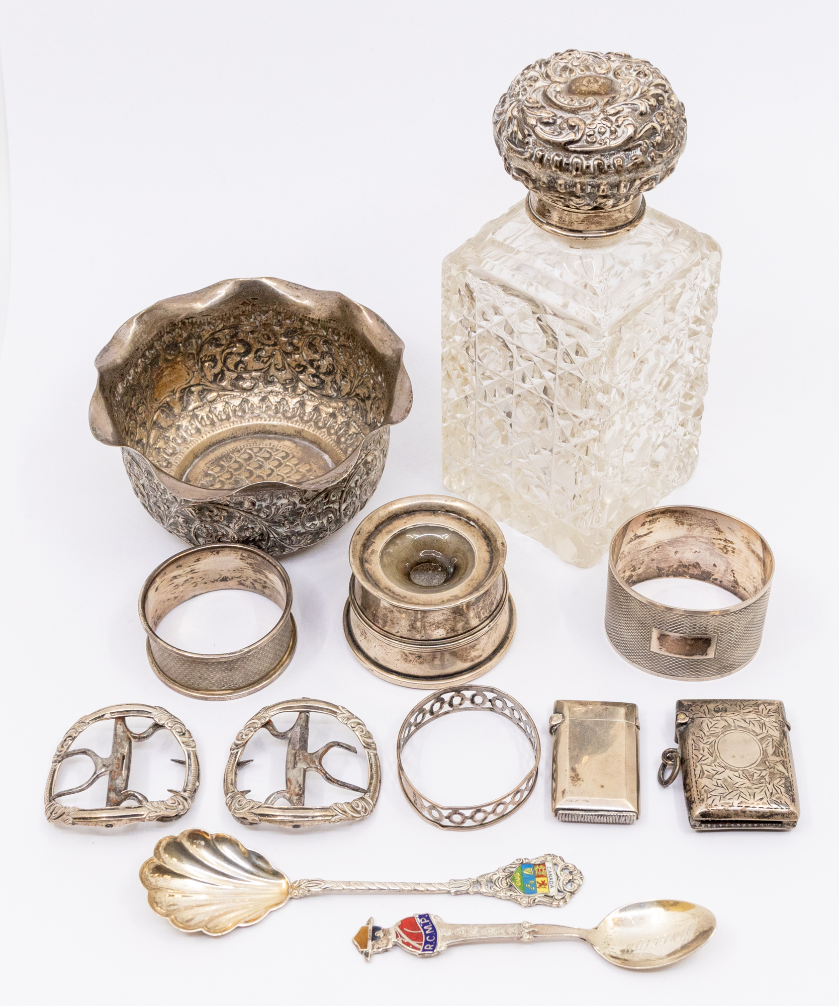 A collection of silver items to include; an early 20th century silver topped square cut glass