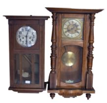 A Vienna wall clock with enamel and brass face, together with an Edwardian period wall clock. (2)