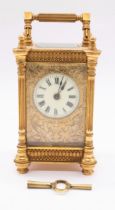 A late 19th Century French R & Co. of Paris brass carriage clock, gilt metal and glazed case