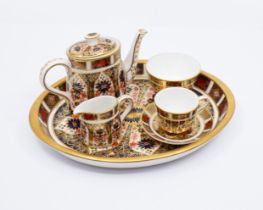 Royal Crown Derby 1128 Imari Pattern - A boxed miniature tea set including tea pot, milk jug,