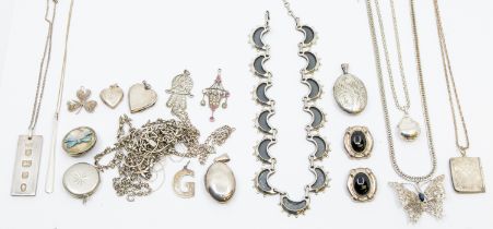 A collection of silver and white metal jewellery metal jewellery to include a locket in the form