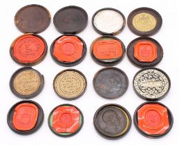 A collection of 19th Century probably Lignum Vitae circular seal boxes and covers, each containing