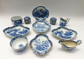 A collection of early 19th century blue and white porcelain dishes, pots, bowls, sugar bowls and