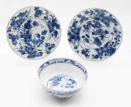 A pair of Chinese blue and white porcelain plates, decorated with flowers, geometric underglaze blue